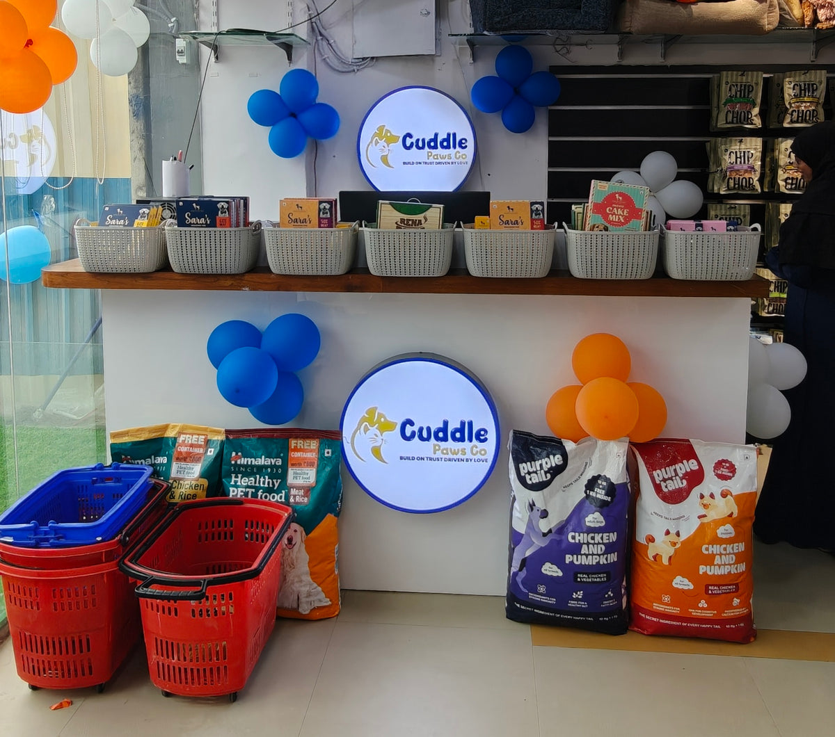 Billing counter at Cuddle Paws Co Gachibowli with the store logo and shopping baskets