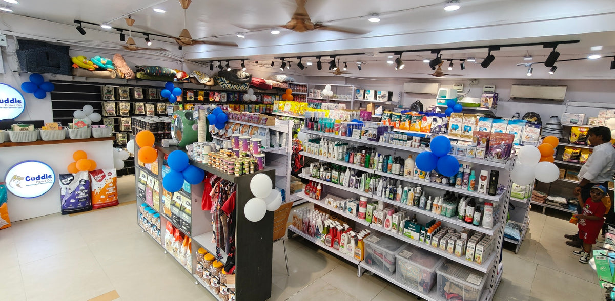Pet pharmacy shelves at Cuddle Paws Co Gachibowli, with shampoos, supplements and tick and flea treatments