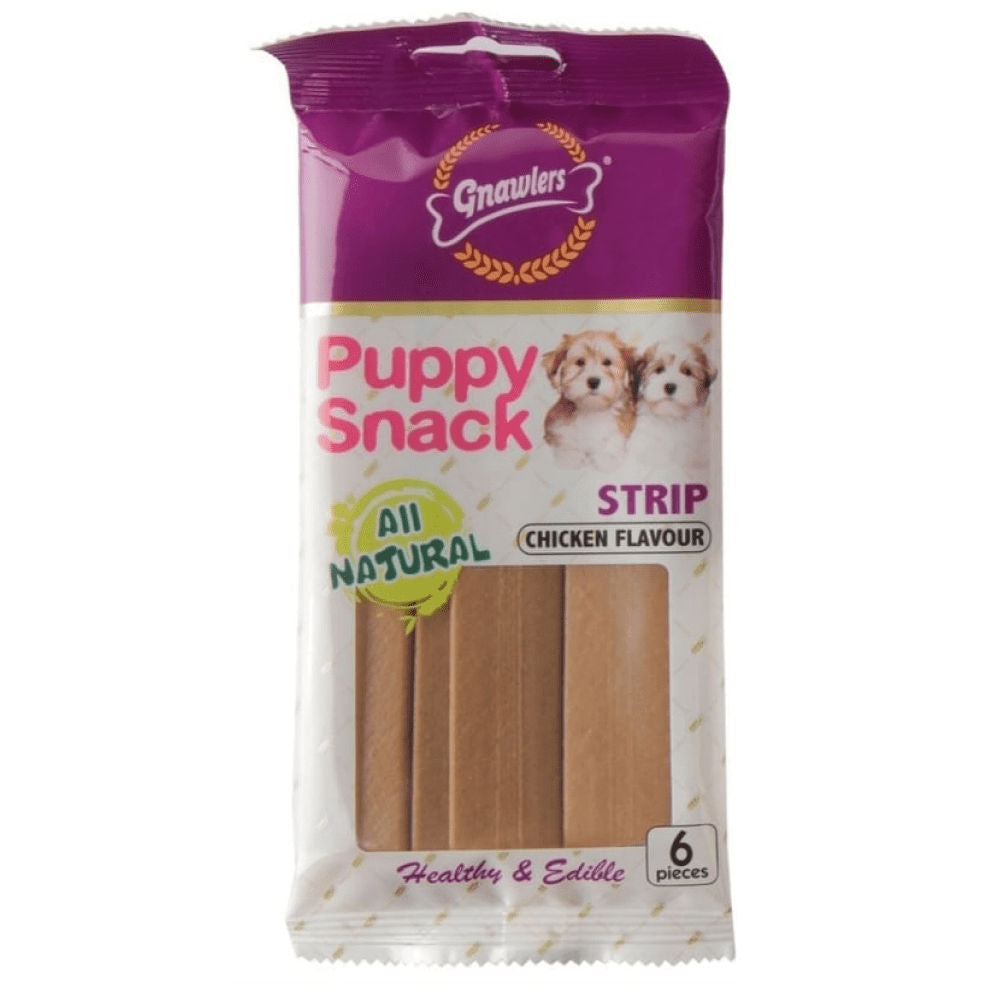 Gnawlers Puppy Snack Strip Chicken Flavoured Dog Treats — in use